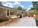 Spacious back deck with a dining table, chairs, a swing set, and an outdoor grill, perfect for entertaining at 109 Lakeview Dr, Summerville, SC 29485