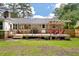 Charming backyard with a wooden deck, pergola, and comfortable seating, ideal for relaxing outdoors at 109 Lakeview Dr, Summerville, SC 29485