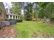 Large backyard with a brick home, screened-in porch, and mature landscaping providing a peaceful retreat at 109 Lakeview Dr, Summerville, SC 29485