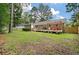 Expansive backyard featuring a wooden deck, pergola, and mature trees, perfect for outdoor entertaining at 109 Lakeview Dr, Summerville, SC 29485