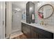 Modern bathroom featuring a glass-enclosed shower, dual vanities, and subway tile, offering a spa-like experience at 109 Lakeview Dr, Summerville, SC 29485