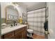 Bright bathroom featuring wainscoting, hexagon tile floors, and updated shower with tub at 109 Lakeview Dr, Summerville, SC 29485