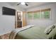 Bright bedroom featuring a ceiling fan, wood floors, and ensuite bathroom with new fixtures at 109 Lakeview Dr, Summerville, SC 29485
