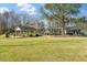 Community clubhouse surrounded by a well maintained lawn and trees at 109 Lakeview Dr, Summerville, SC 29485