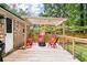 Cozy wooden deck with pergola, seating, and a fire pit, perfect for gathering with friends and Gathering at 109 Lakeview Dr, Summerville, SC 29485