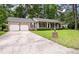 Traditional-style home featuring a two-car garage, and meticulously manicured landscaping at 109 Lakeview Dr, Summerville, SC 29485