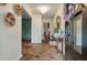 Inviting foyer with decorative wall art, stone flooring, and a wood accent table with stylish decor at 109 Lakeview Dr, Summerville, SC 29485