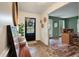 Bright foyer with a decorative wreath on the door, stone flooring, and an open view to the office at 109 Lakeview Dr, Summerville, SC 29485