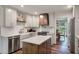 Bright kitchen featuring white cabinets, a farmhouse sink, butcher block island, and modern appliances at 109 Lakeview Dr, Summerville, SC 29485