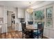 Bright eat-in kitchen featuring a chandelier over a round table and large windows overlooking backyard at 109 Lakeview Dr, Summerville, SC 29485