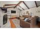 Spacious living room featuring a leather sectional, wood beams, and a decorative brick fireplace at 109 Lakeview Dr, Summerville, SC 29485
