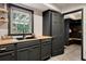 Mudroom with black cabinets, a butcher block countertop, and black framed window at 109 Lakeview Dr, Summerville, SC 29485