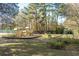Wood playground area featuring slides, climbing structures, and swings at 109 Lakeview Dr, Summerville, SC 29485