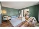 Cozy playroom with wood-look flooring, green accent wall with paneling, and decorative accents at 109 Lakeview Dr, Summerville, SC 29485