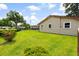Well-kept backyard with green lawn, mature shrubs, and a partial fence line at 109 Rahway Rd, Goose Creek, SC 29445