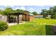 Spacious backyard features a pergola, shed, and a lush green lawn at 109 Rahway Rd, Goose Creek, SC 29445