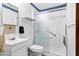 Bright bathroom with modern vanity, sink, shower, and sleek, sliding glass doors at 109 Rahway Rd, Goose Creek, SC 29445