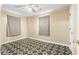 Simple bedroom with geometric tile flooring, ceiling fan, and neutral walls at 109 Rahway Rd, Goose Creek, SC 29445
