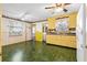 Spacious kitchen with vintage yellow cabinets, brick backsplash, white appliances, and eat-in area at 109 Rahway Rd, Goose Creek, SC 29445