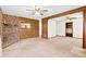 Open-concept layout with vintage wood paneling and a brick fireplace at 109 Rahway Rd, Goose Creek, SC 29445