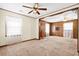 Spacious living area with wood paneling, carpet and natural light at 109 Rahway Rd, Goose Creek, SC 29445