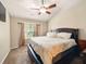 A well-lit bedroom with a comfortable bed, neutral walls and large windows at 113 Mapperton Ct, Summerville, SC 29485