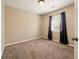 Empty bedroom featuring carpet, neutral walls and window with dark brown curtains at 113 Mapperton Ct, Summerville, SC 29485