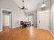 Dining room with wood floors featuring a dining table and a white front door at 113 Mapperton Ct, Summerville, SC 29485