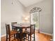Dining room with wood floors featuring a dining table with chairs and a bright window at 113 Mapperton Ct, Summerville, SC 29485