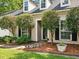 Well-landscaped front entrance with lush greenery and decorative lighting at 113 Mapperton Ct, Summerville, SC 29485