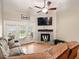 Cozy living room features a fireplace, a ceiling fan, and french doors at 113 Mapperton Ct, Summerville, SC 29485