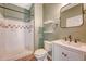 Bathroom with a walk in shower, floating shelves and a modern vanity at 130 River Landing Dr # 2310, Daniel Island, SC 29492