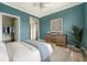 Bright and airy bedroom with lots of natural light and tasteful decor, including art and plants at 130 River Landing Dr # 2310, Daniel Island, SC 29492