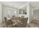 Comfortable dining area featuring a round table, seating for six, and backyard access at 130 River Landing Dr # 2310, Daniel Island, SC 29492