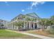 Impressive Kingside building featuring multiple levels with balconies, pillars, and outdoor seating areas at 130 River Landing Dr # 2310, Daniel Island, SC 29492