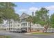 Condo complex boasts meticulously maintained landscaping, palm trees, and convenient parking at 130 River Landing Dr # 2310, Daniel Island, SC 29492