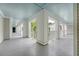 Exterior view of a breezy walkway with white pillars and light blue ceilings at 130 River Landing Dr # 2310, Daniel Island, SC 29492