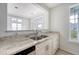 Open kitchen design with a breakfast bar, seamlessly connecting to the dining and living area at 130 River Landing Dr # 2310, Daniel Island, SC 29492