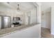 Bright kitchen with granite countertops and stainless steel appliances, creating a modern design at 130 River Landing Dr # 2310, Daniel Island, SC 29492
