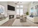 Bright living room with a fireplace, lots of natural light, and a cozy atmosphere at 130 River Landing Dr # 2310, Daniel Island, SC 29492