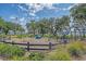 Inviting fenced playground area with swings, slides, and climbing structures for children to enjoy at 130 River Landing Dr # 2310, Daniel Island, SC 29492
