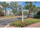 Daniel's Landing signage amidst blooming flowers and palm trees provides a welcoming entrance at 130 River Landing Dr # 2310, Daniel Island, SC 29492