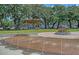 Charming water feature at park with lush greenery and mature trees creating a serene atmosphere at 130 River Landing Dr # 2310, Daniel Island, SC 29492