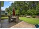 Backyard with a patio set, hammock, and privacy fence, ideal for outdoor relaxation at 132 Daniels Ridge Dr, Summerville, SC 29485