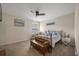 This bedroom offers a ceiling fan, carpeted floor, and window for natural light, creating a comfortable, private space at 132 Daniels Ridge Dr, Summerville, SC 29485