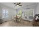 Bright dining area featuring a ceiling fan, table with seating for six, and a glass door to the outside at 132 Daniels Ridge Dr, Summerville, SC 29485
