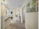 Cozy hallway features neutral carpet and an antique dresser, adding character and warmth to the home's interior at 132 Daniels Ridge Dr, Summerville, SC 29485
