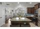 Beautiful kitchen featuring granite countertops, stainless steel appliances, dark cabinetry, and an island with seating at 132 Daniels Ridge Dr, Summerville, SC 29485