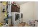 Functional laundry room with side-by-side washer and dryer and overhead cabinets at 132 Daniels Ridge Dr, Summerville, SC 29485