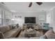 Comfortable living room featuring a gray sectional sofa, hardwood floors, and a modern entertainment center at 132 Daniels Ridge Dr, Summerville, SC 29485